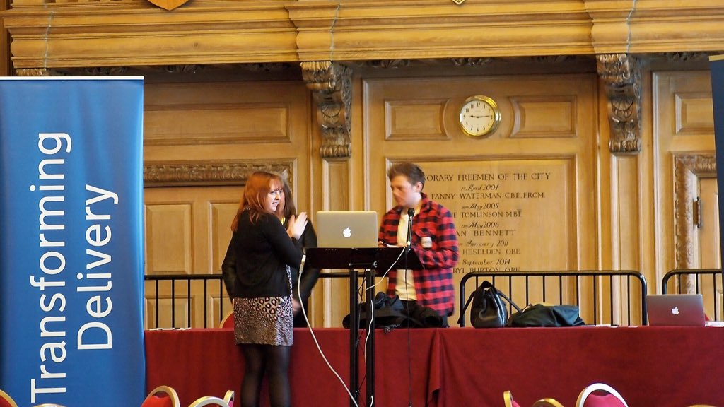 Speakers on the stage at the Academy community day