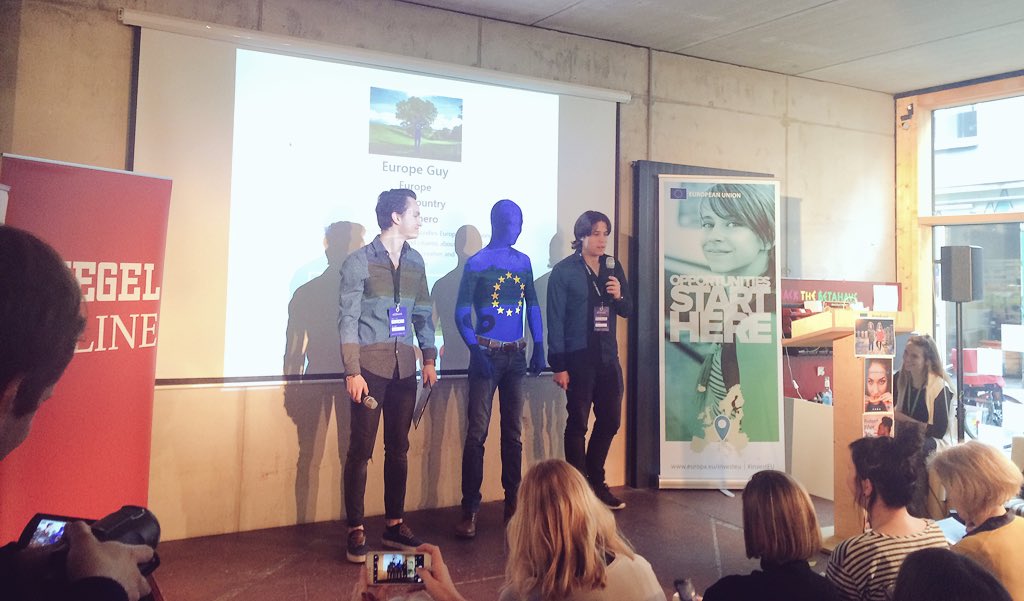 DanielFritzEU's tweet photo. We are all on stage! "We are all #Europeguy. We all have the same power as Europeguy!" 2000 people reached since 2am campaign launch. Two presentors are from Venezuela. External perspective helps to appreciate what we take for granted. Europe starts with u! #EUhack https://t.co/DbfwLr6Z4Y