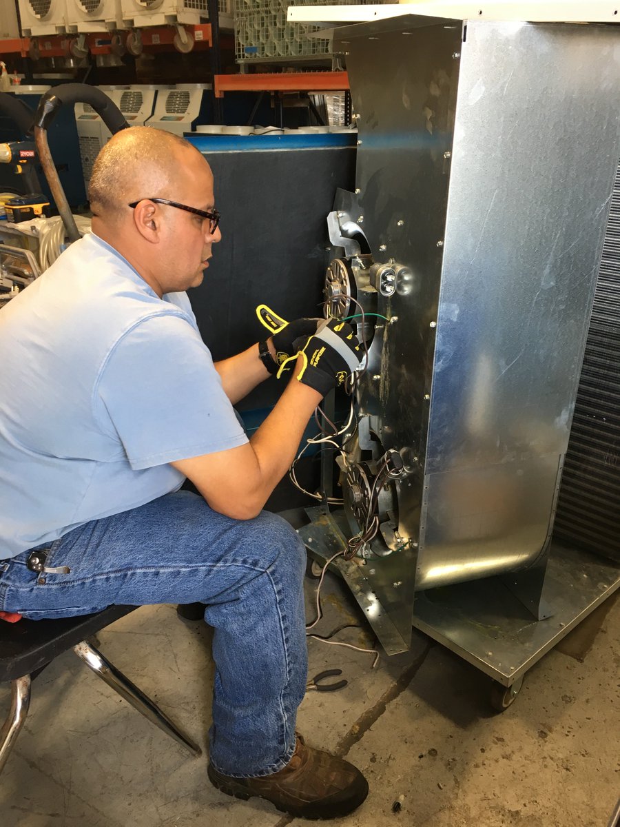 PortableCooling's tweet photo. NO! DON'T CUT THE GREEN WIRE!! Don't worry. He's our expert technician on the job. Notice the posture and concentration. https://t.co/LoTmqlgI2D