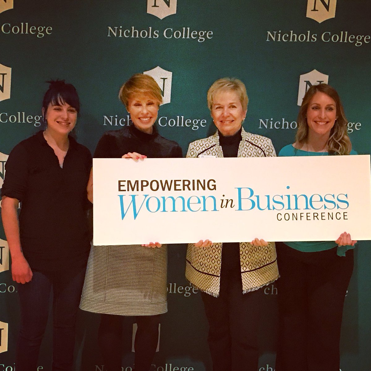 Nichols_College's tweet photo. .@NC_EWIB keynote speakers/co-founders of @wkdgoodcupcakes Dani Vilagie and Tracey Noonan stand with @NicholsPrez Engelkemeyer and @IWL_nichols Director Rachel Ferreira at @NC_EWIB. #EWIB2018 #business #WomeninBusiness #cupcakes #dessert #Empowerment https://t.co/obj3V07F5c