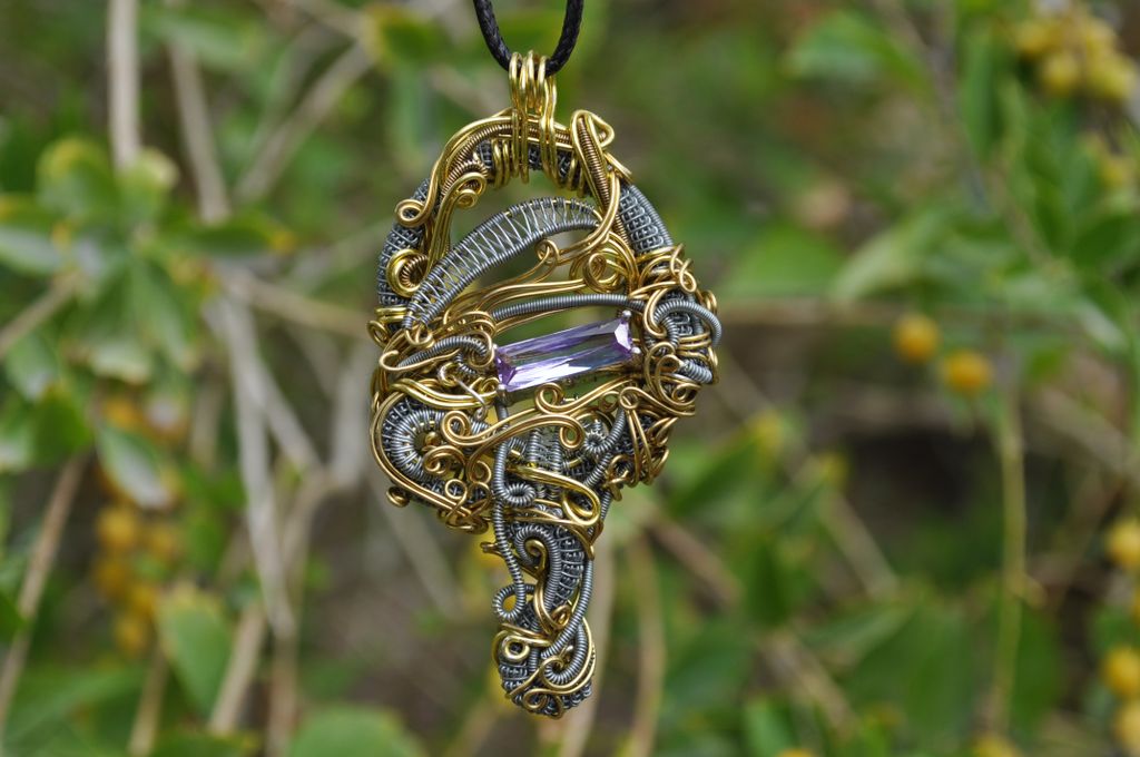 Rawvolutionjwls's tweet image. Heady Wire Wrapped Amethyst Facet in steal and gold plated copper wire.