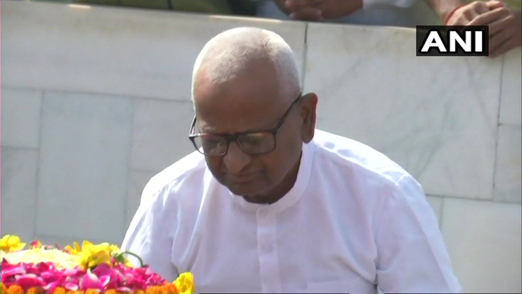 ANI's tweet photo. Anna Hazare pays tribute at Raj Ghat in #Delhi; will begin an indefinite fast demanding a competent Lokpal and better production cost for farm produce, later today https://t.co/DXaSsx96gJ