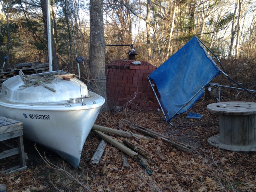 Dungeon_Crafter's tweet photo. That red thing in the background is a huge oven, to roast pigs or the enemies of our family whole. 
And half a boat.  I try not to overthink the why or how that got there. #imnotonaboat #swampyankee https://t.co/lHU4dsd5GH