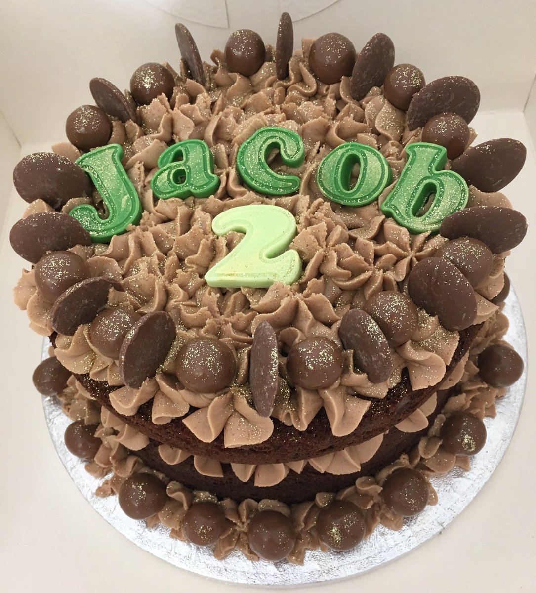 Simple chocolate cake topped with Maltesers &amp; buttons for Jacob’s 2nd Birthday 💚🎂