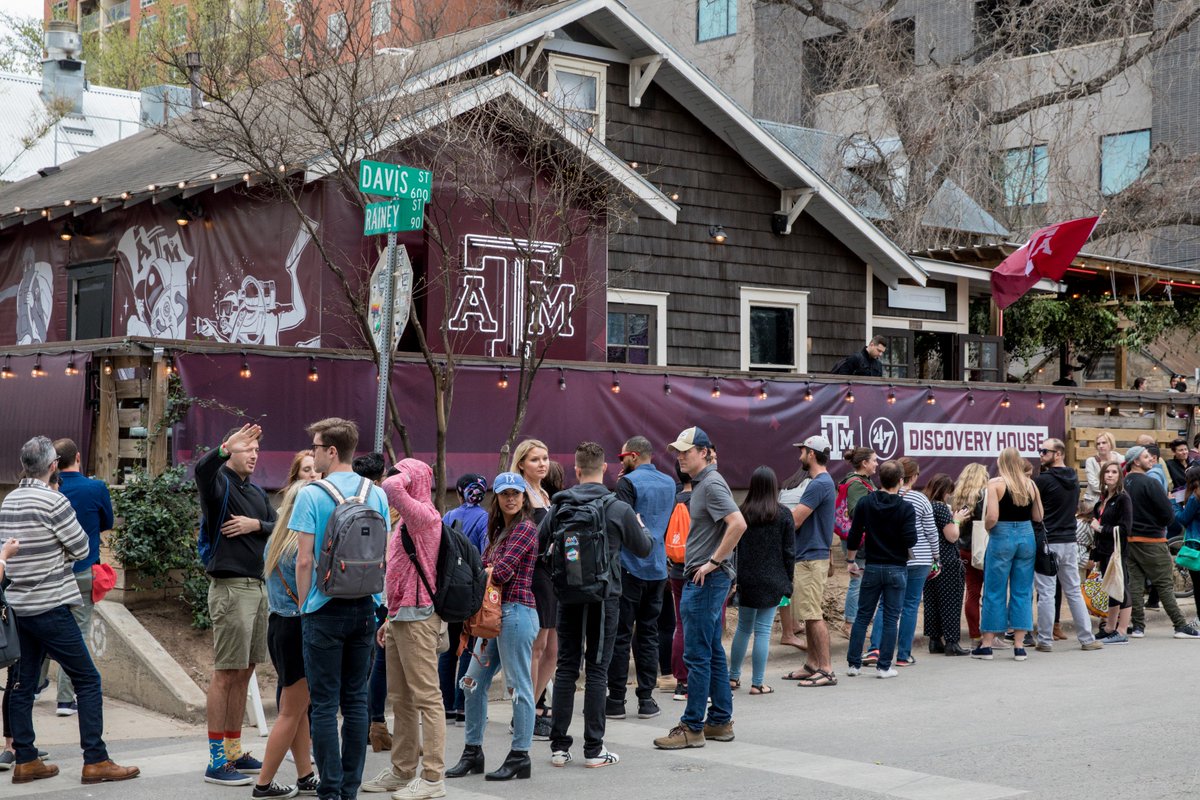 line of people standing outside of the Texas A&M x '47 Discovery House at SXSW