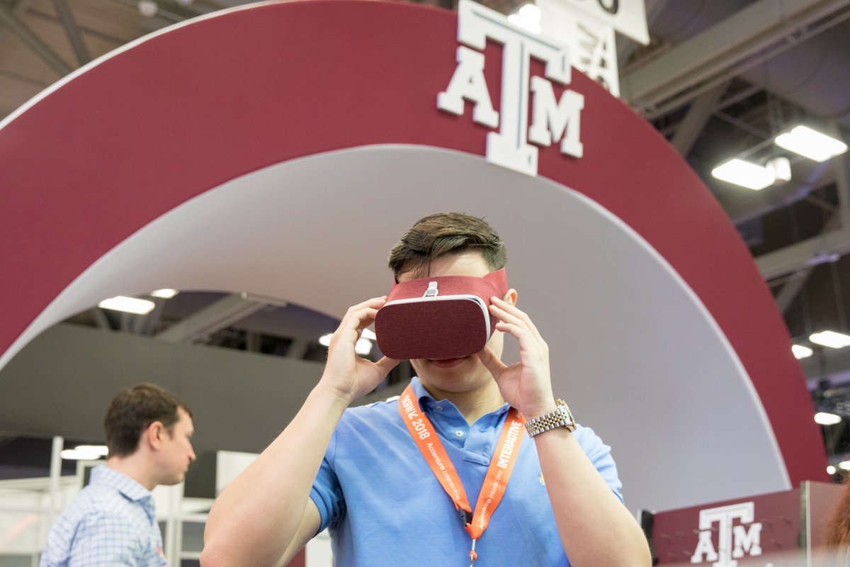 man looking through virtual reality goggles