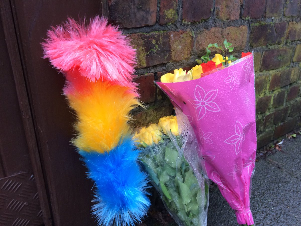 Tickling stick and flowers outside the Knotty Ash home of Sir Ken Dodd, who’s died at the age of 90.