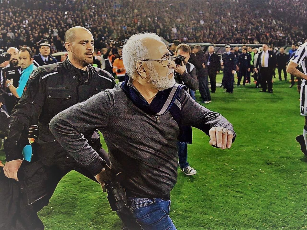 ODDSbible's tweet photo. Crazy scenes in Greece last night:

⚽️ PAOK score a late winner but the AEK players claim that it was offside 

❌ Referee disallows the goal which leads to the PAOK players protesting the decision and the owner storming onto the pitch with a gun in his hand https://t.co/RinCLpbN4y