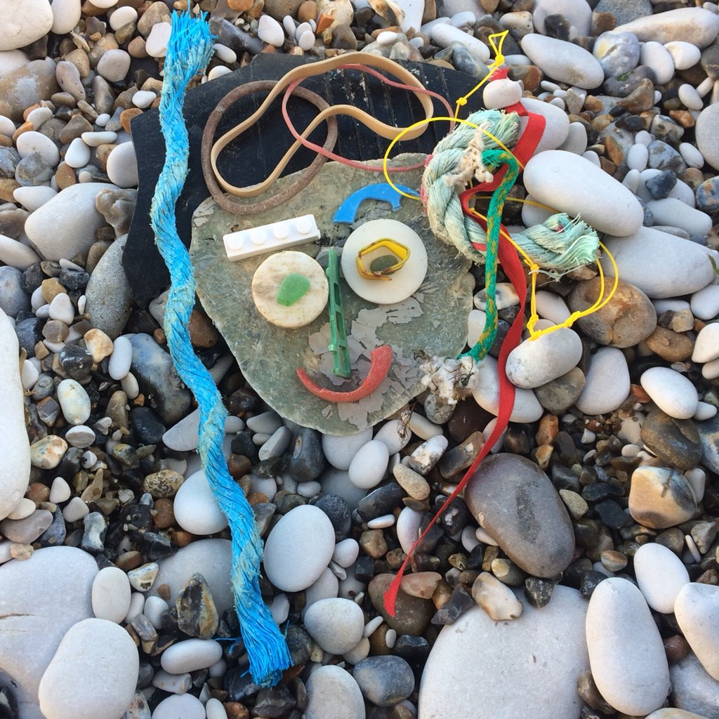 Four funky faces made from litter at #Lulworthcove and #durdledoor. #lovedorset #2minutebeachclean