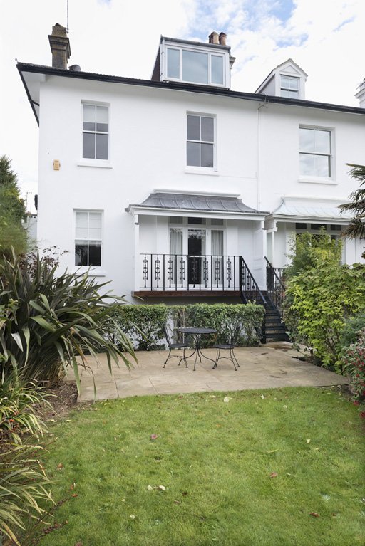 An existing external metal fire escape stair was removed and replaced by a new traditionally detailed balcony, canopy and steps down to the rear garden.