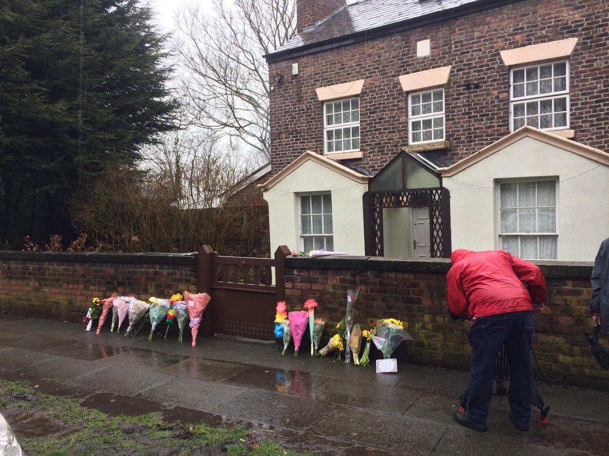 MerseyFocus's tweet photo. Flowers and tickling sticks are laid in tribute outside the home of Sir Ken Dodd, who has passed away at the age of 90. Tributes continue to pour in. https://t.co/5wGKBjtzSY