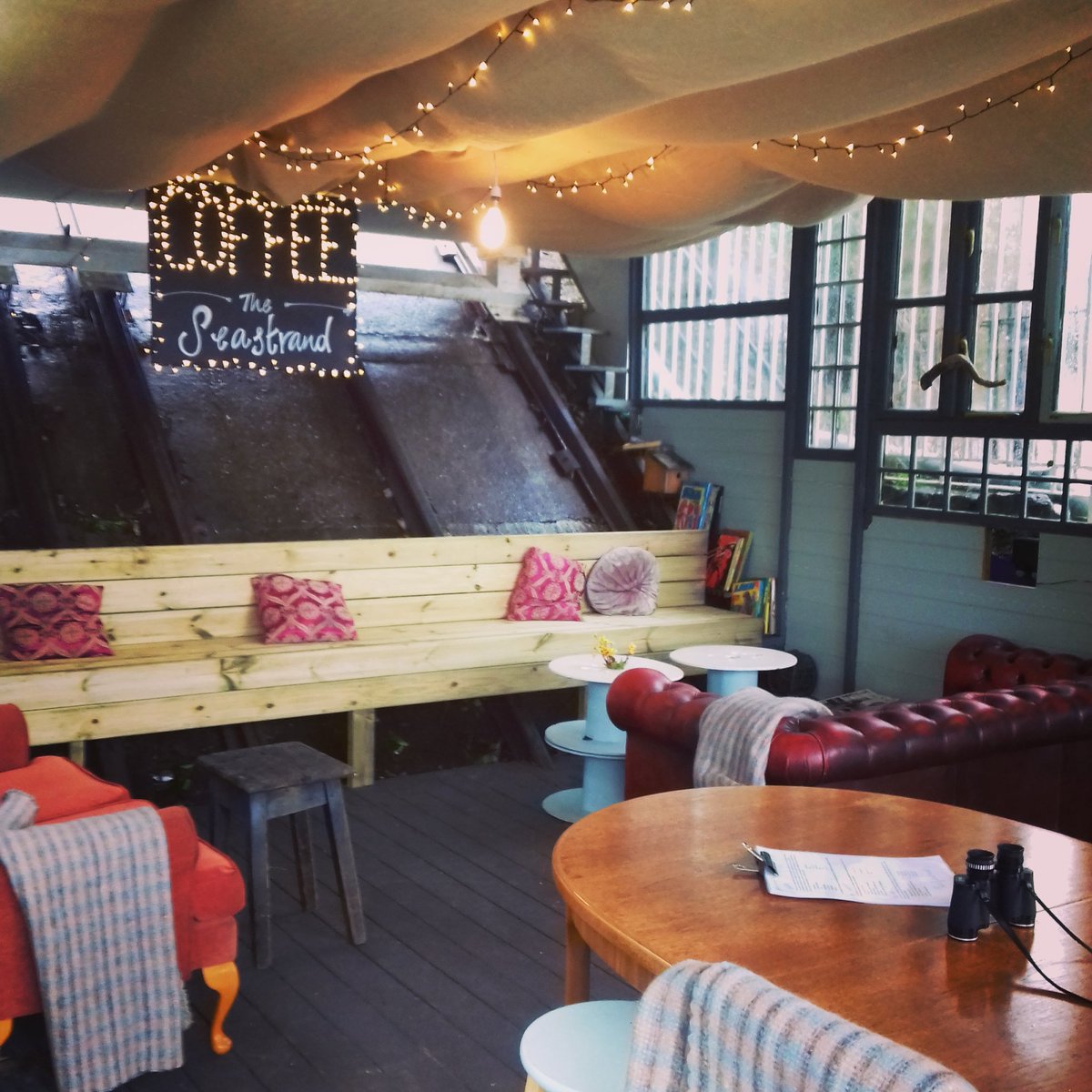 Ta-da!! We have a new #bench built into the rails, #hessian ceiling, comfy #sofas, new tables and a new sparkly #sign to go with new 'walls' and #windowsmadefromwindows It's super cosy folks! #scarborough #coffeekiosk #bigdreamssmallspaces #weusedtobeatramstation #coffee