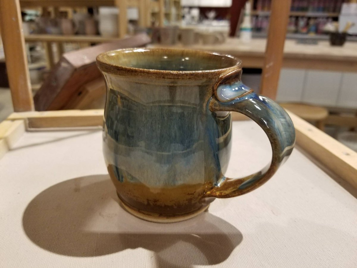 Awesome mug by Adriane Schultz.  Glossy, melty, blendy glaze.  Nice handle detail.