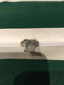 #stolen A Diamond Ring, claw set with an emerald-cut diamond weighing 9.00 carats, set between tapered baguette diamond shoulders, mount stamped 950 for platinum. The incident was very violent and occurred in the Notting Hill area of London #stolenjewellery