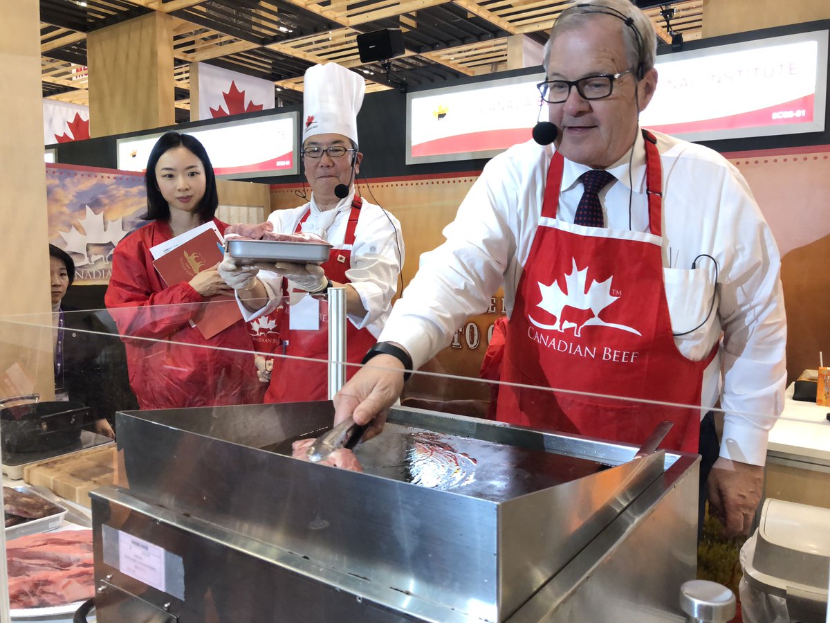 CanadianBeef's tweet photo. Minister Lawrence MacAulay, Canada Beef President Francis Andres, and Japan lead Daisuke Shimojima collaborated their cooking skills at Food Ex Japan last week, Asia's largest trade show for food. https://t.co/8LqJ2G7vAg