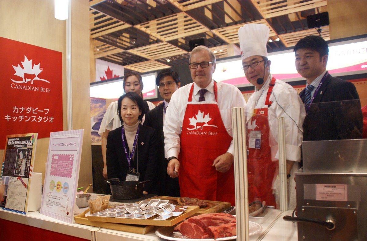 CanadianBeef's tweet photo. Minister Lawrence MacAulay, Canada Beef President Francis Andres, and Japan lead Daisuke Shimojima collaborated their cooking skills at Food Ex Japan last week, Asia's largest trade show for food. https://t.co/8LqJ2G7vAg
