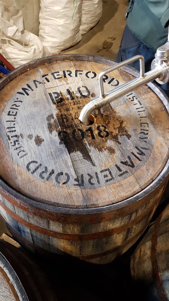 WaterfordWhisky's tweet photo. James is starting to fill the spirit distilled from biodynamic barley into American oak. (That’s @WaterfordSpirit’s head on the selfie.) https://t.co/joq7vYizBw
