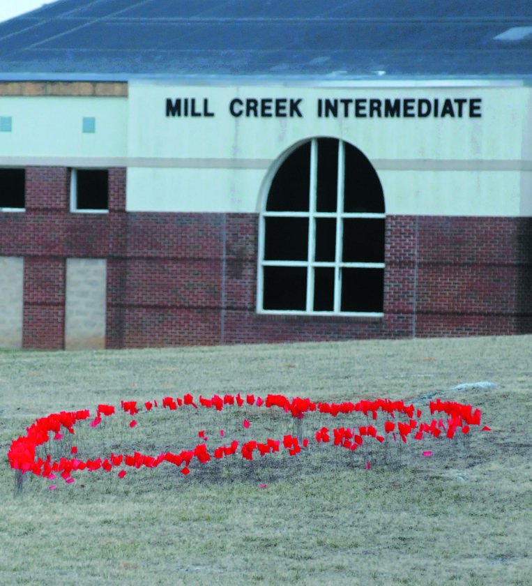 TheJournalWV's tweet photo. Mill Creek Intermediate School teachers put red flags in the ground near the front of the school in the shape of a heart as a gesture of thanks to the community for the support over the past couple of weeks during the teacher work stoppage. (Journal photo by Ron Agnir) https://t.co/D4h34ZdyYN