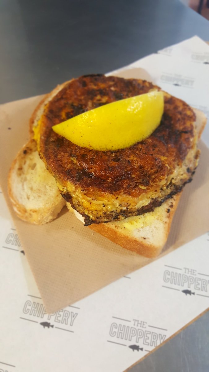 Mussel and bacon fritter on buttered bread. Grab yours at both stores today! #sodarntasty #bestcomboever