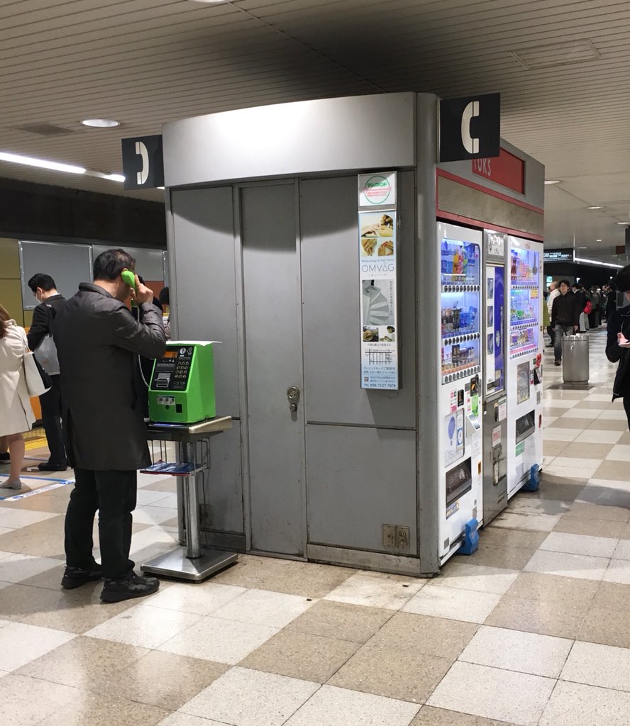 Person using a pay phone