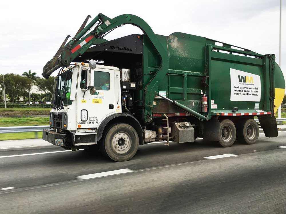 OntPoliceReport's tweet photo. The small sedan had struck the recycling truck from the rear as it was collecting waste and was wedged under the truck. https://t.co/IFrJceblJc