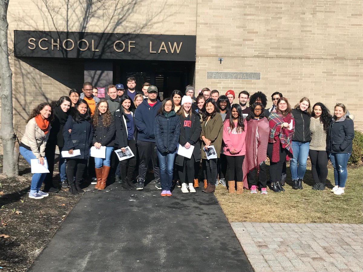 Students at @StJohnsLaw standing in rememberance of the 17 lives lost at #StonemanDouglasHS & standing in solidarity with those who are advocating for gun control measures at federal and state levels & mental health resources for peers #NationalWalkoutDay #Enough #EndGunViolence