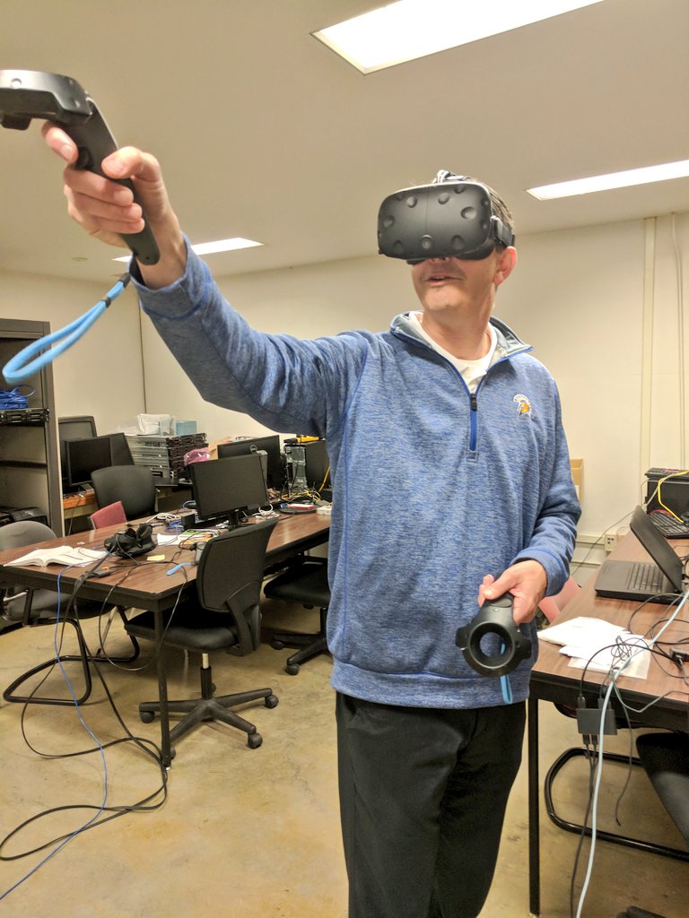 TJRice's tweet image. @coachbrennan took an underwater journey today at the @SJSUEngineering #VR lab - I think this is around when the whale showed up 🐳 #SJSUEngineering #Collaboration #Technology