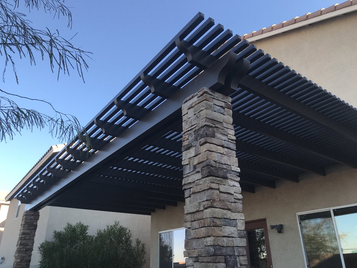 BellaPatioLV's tweet photo. Stone pillars really make a patio cover stand out, like with this this lattice, siennawood, with scalloped tails. #patiocover #patiolife #lattice #scallop #homeimprovement #architecturalphotography #aluminumpatiocovers #duralum #alumawood #BellaPatio https://t.co/V3GOHWQA5a