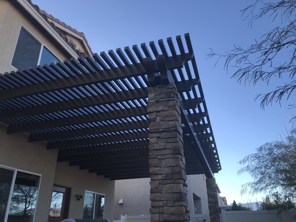 BellaPatioLV's tweet photo. Stone pillars really make a patio cover stand out, like with this this lattice, siennawood, with scalloped tails. #patiocover #patiolife #lattice #scallop #homeimprovement #architecturalphotography #aluminumpatiocovers #duralum #alumawood #BellaPatio https://t.co/V3GOHWQA5a