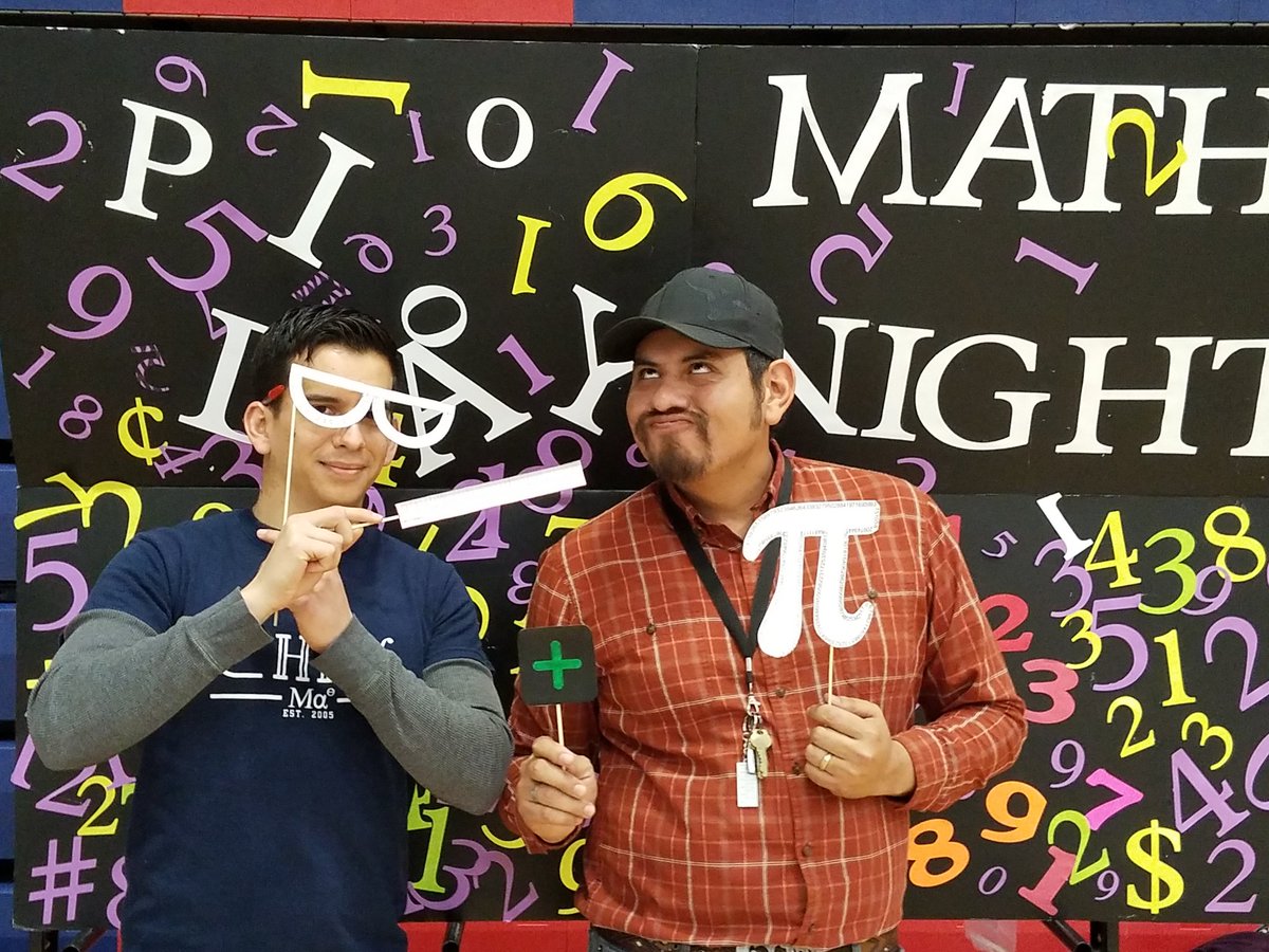 CHHSMathDept's tweet photo. Mr. Uribe and Mr. Benavides enjoying Math Night in their own way https://t.co/GJzDQum8aC