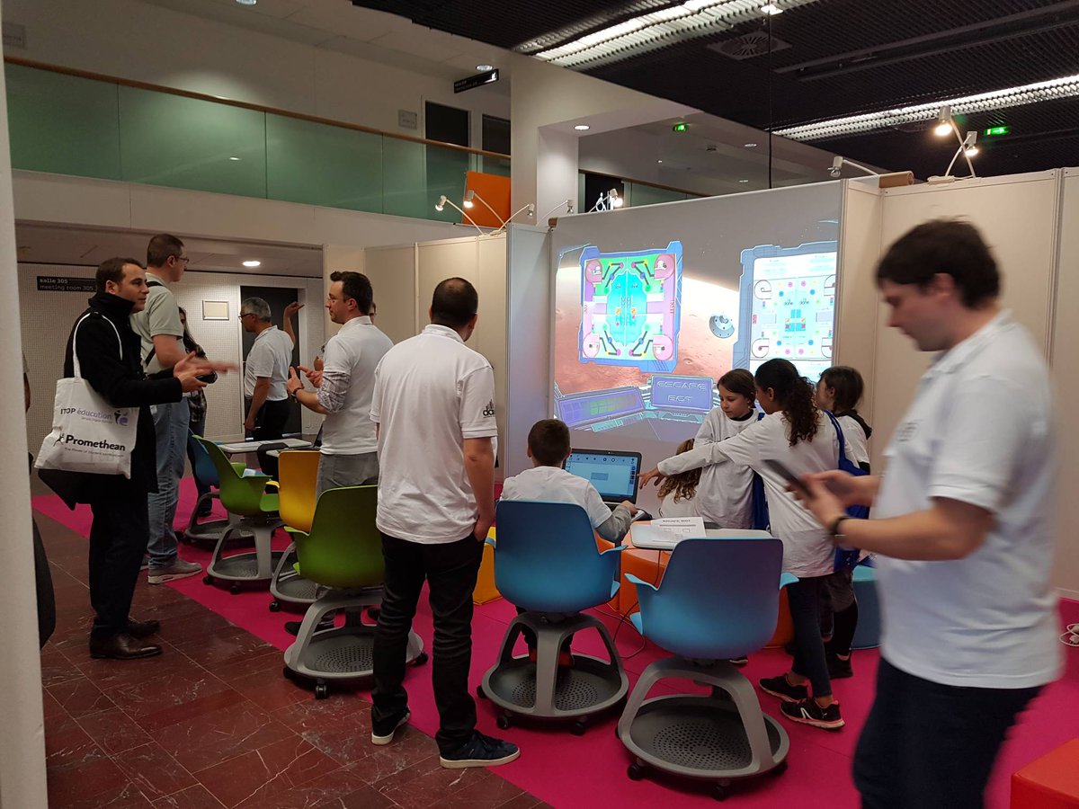 CodeWeekEU's tweet photo. Kids getting ready for #EscapeBot by @DaneVersailles a game teaching #coding remotely. #eduspot2018 https://t.co/j5IBw7cXmo