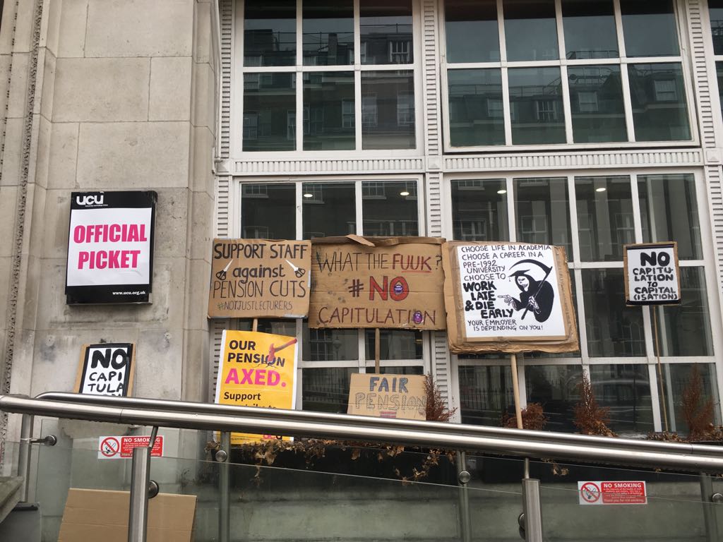 academotic's tweet photo. We now have a veritable blooming placard garden... What next needs to be said...? #solidarity #respectourpicketline #ussstrikes #ucustrike #UCLprotest #nocapitulation https://t.co/3WF2gQVhaC