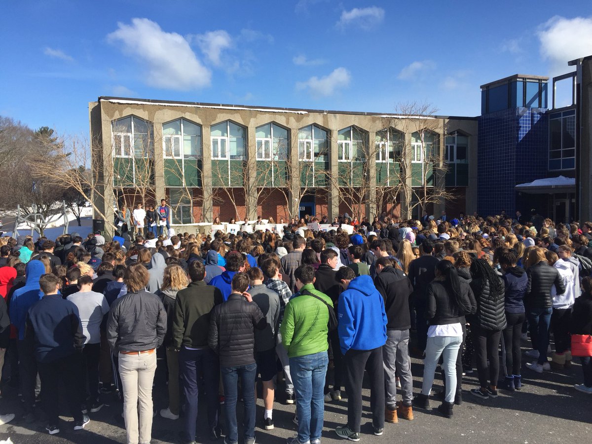 #Scituate students up front holding photos of #ParklandSchoolShooting victims. 17 moments of silence happening now.