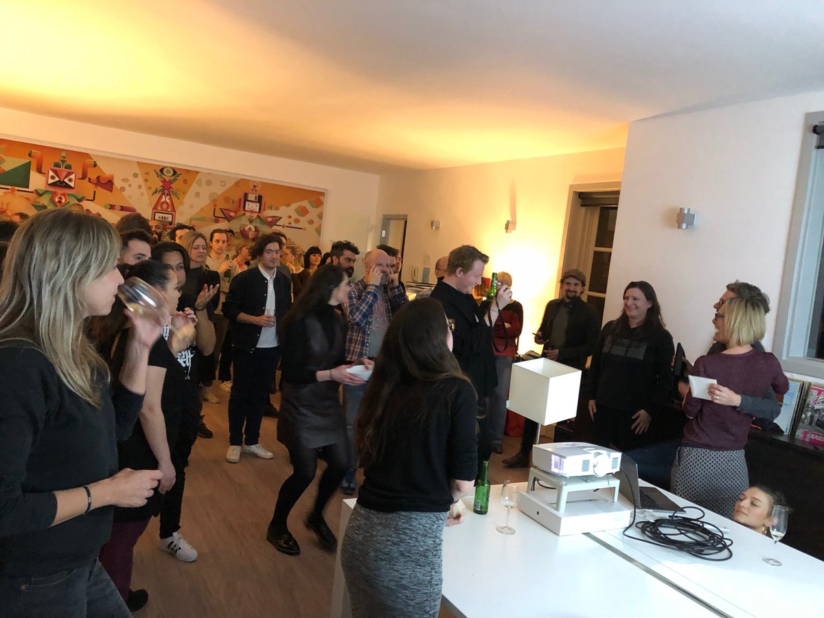 Aquent offices, a group of people with photos being taken of myself and the award being presented.