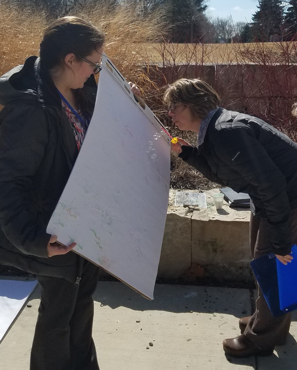 WaukeshaCoHHS's tweet photo. It’s #NationalBubbleWeek & our ADRC Division is bursting w/workplace camaraderie. They popped outside at lunch to create Bubble Art w/paint mixed into liquid bubbles. A bang-up activity for grandparents & grandkids too! Grab your wand & get outside…it’s good for the mind & body! https://t.co/TyBJd17NHi