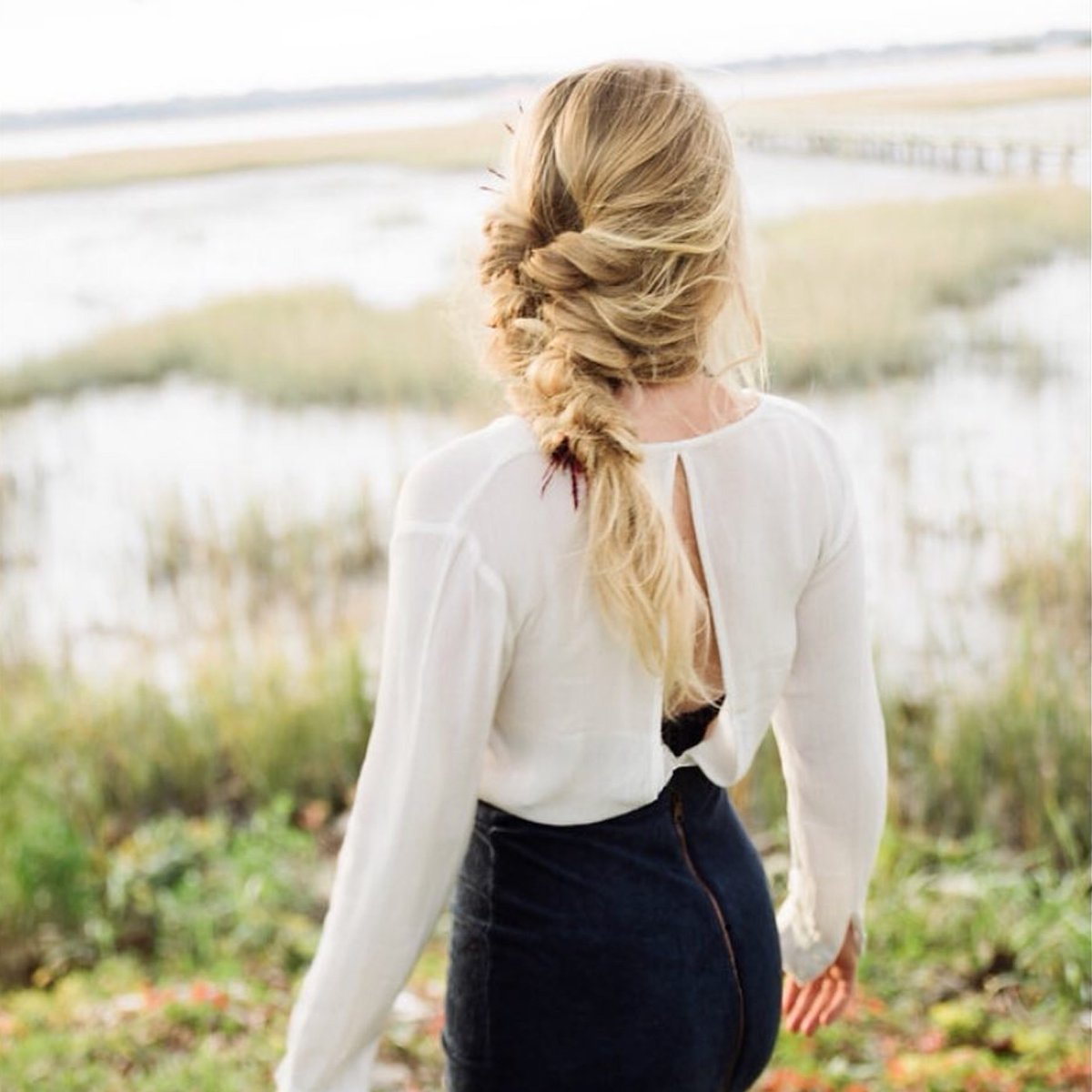 Beautiful boho-inspired updo from bridal stylist Danna Breaux. #biosilk #silktherapy #haircare #updo #hairstyles