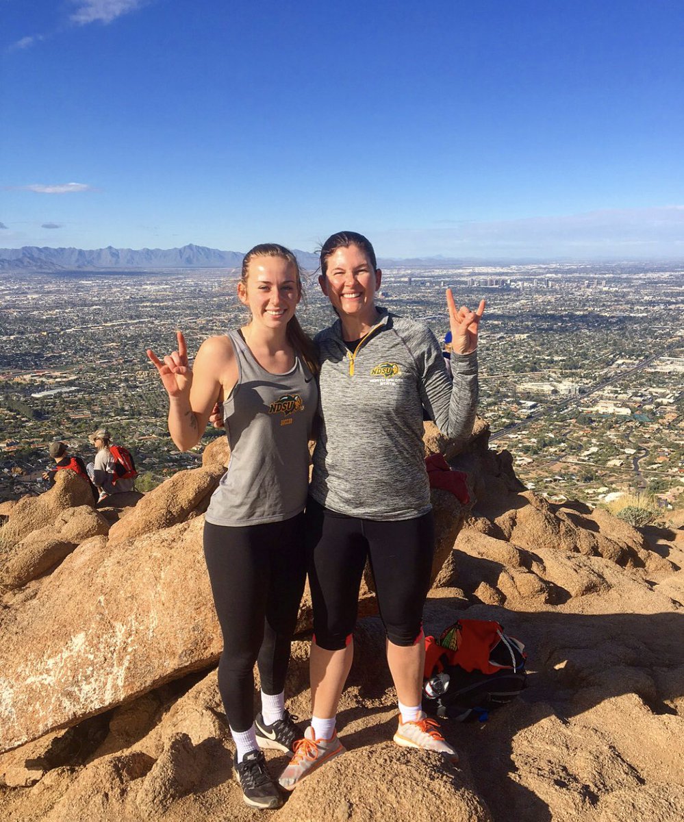 NDSUsoccer's tweet photo. Two very different sceneries for Laura and Dani!! LP is in warm Arizona hiking Camelback Mountain! While Dani is trying to stay warm ice fishing on “The Big White Shell” !! #BisonRoaming #GoBison #BisonPride 🤘🏼💚💛 https://t.co/TgBRmCq0U4