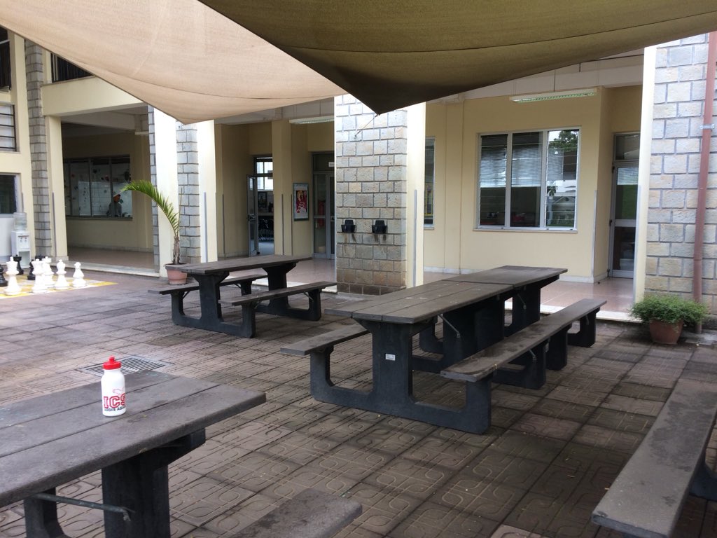 BenjaminToyryla's tweet photo. The benches below the quad are where you can always find groups gathered at any time of day, and the buzz of activity is always a welcome sound. Not just a place for work, but for frequent, fun, and fruitful socialising. @ICSAddis #ZednCrew https://t.co/eooEGVlaTH