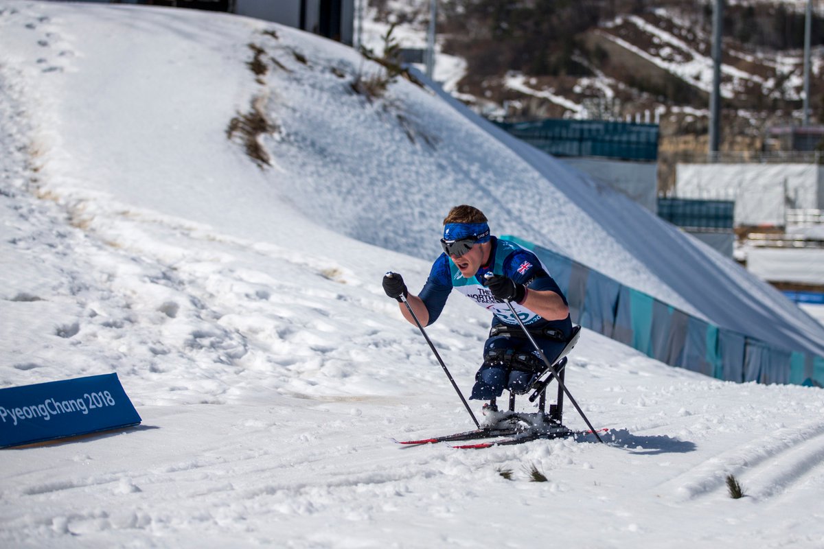 Scott meenagh climbs on his sit skis