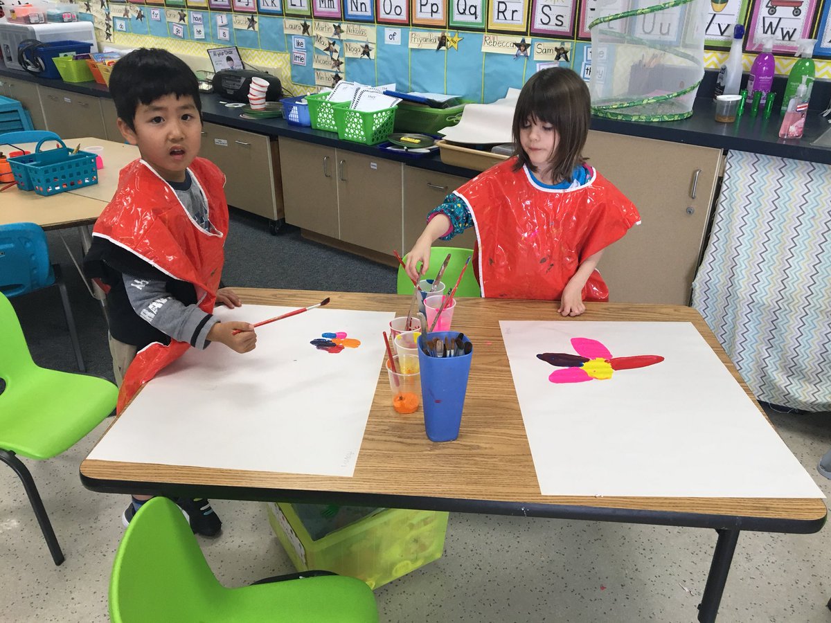 Painting flowers in class for our own Kinder-“garden”