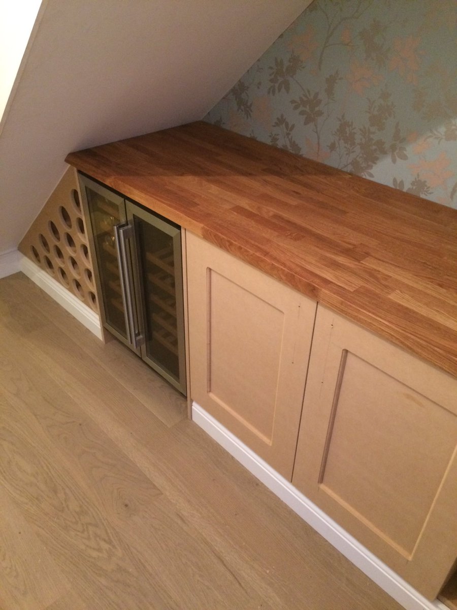Understair storage with bespoke wine rack.