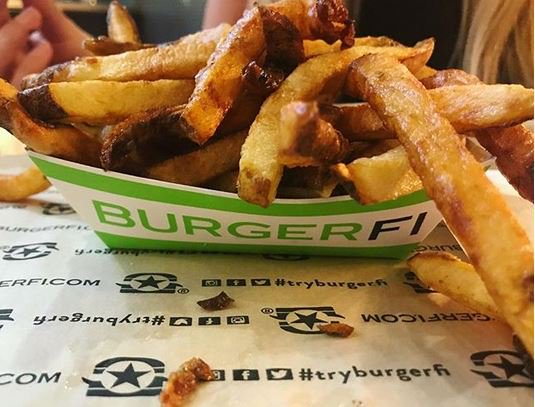 Mesmerized by all-natural, crispy, crunchy fries! #FRYDAY #TryBurgerFi 🍟✨ - heidishungryadventures