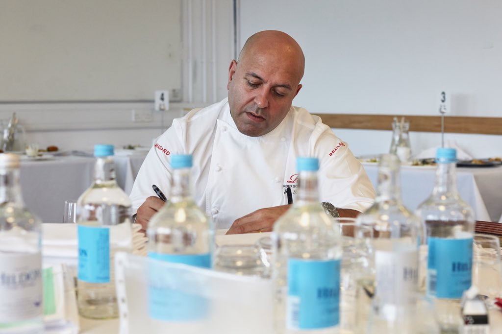RouxScholarship's tweet photo. Judging the #Rouxscholarship2018 is thirsty work, so thank goodness one of our sponsors is @hildon_water. Although, we can’t verify *exactly* how many bottles were consumed by @Satbains1 https://t.co/mNDzju8V3c