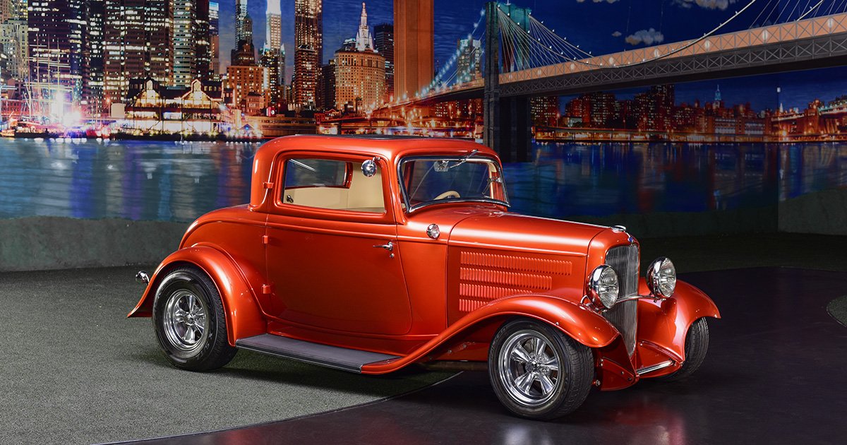 Painted in Tangerine pearl paint with custom beige interior, this