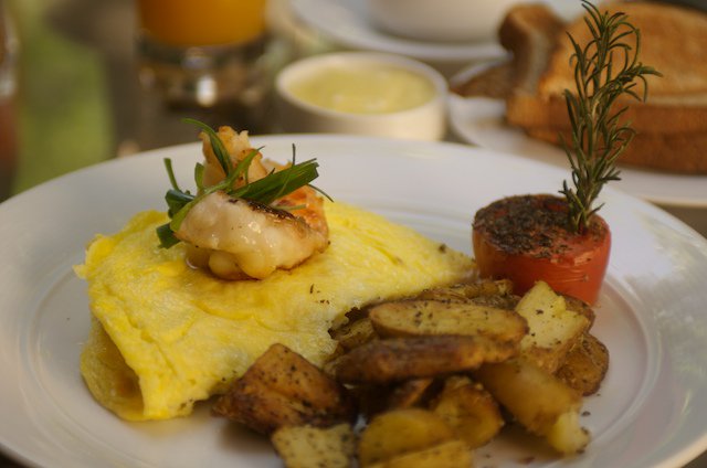 A breakfast fit for a king- our Maine Lobster Omelette. With Hollandaise sauce, herb tomato and roasted fingerling potatoes.