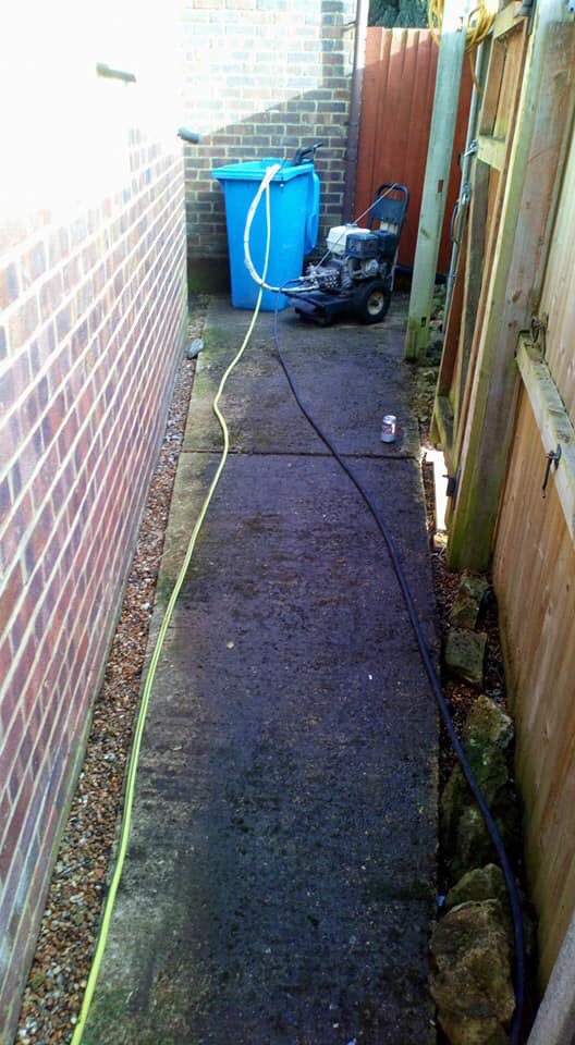 Before and after pictures of a recent concrete path cleaning job