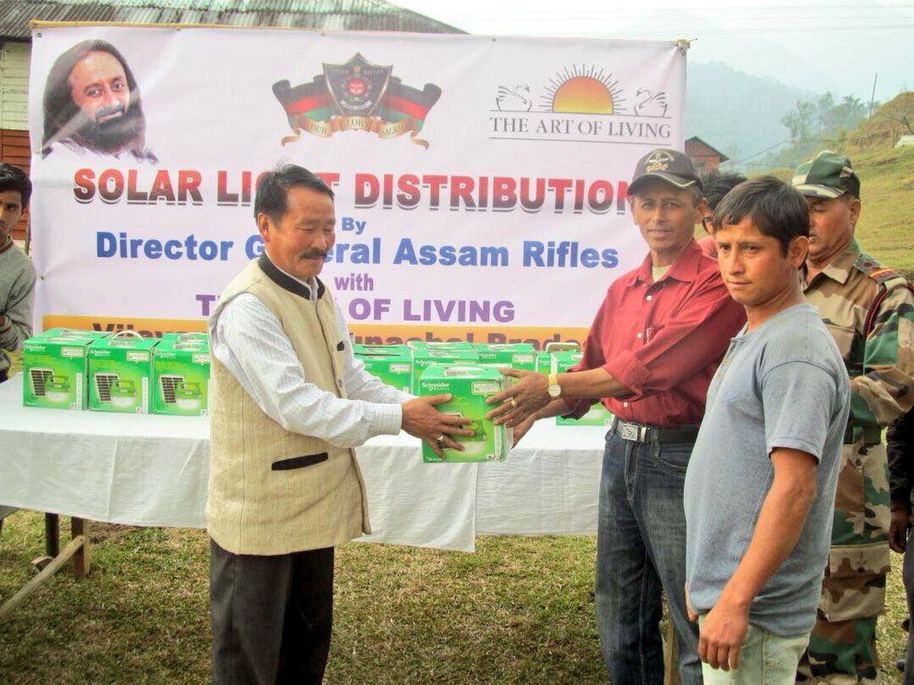 Gurudev's tweet photo. The @ArtofLiving commenced its Border Village Development Program, in association with Assam Rifles, by distributing solar lights to 147 families in Vijaynagar, Arunachal Pradesh, the remotest village of India on the Myanmar border. https://t.co/BFDDfAibin
