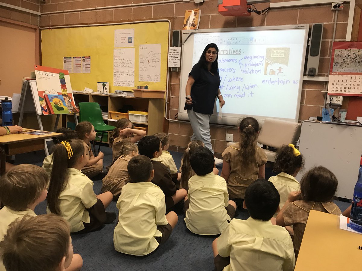 Instructional leader working with Stage 1 on narratives.