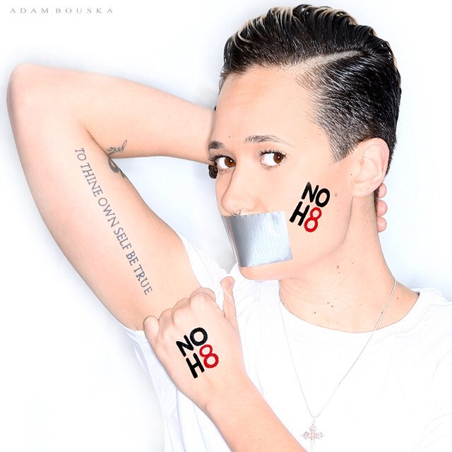 Lavisov's tweet photo. I did this for so many reasons, but above all else I stand for #NoH8 - My friend was almost murdered a month ago and is still alive today because of her light. I survived sexual abuse and today I #thrive - #light #love #riseup #legislationforchange https://t.co/9FTEDiBqpJ