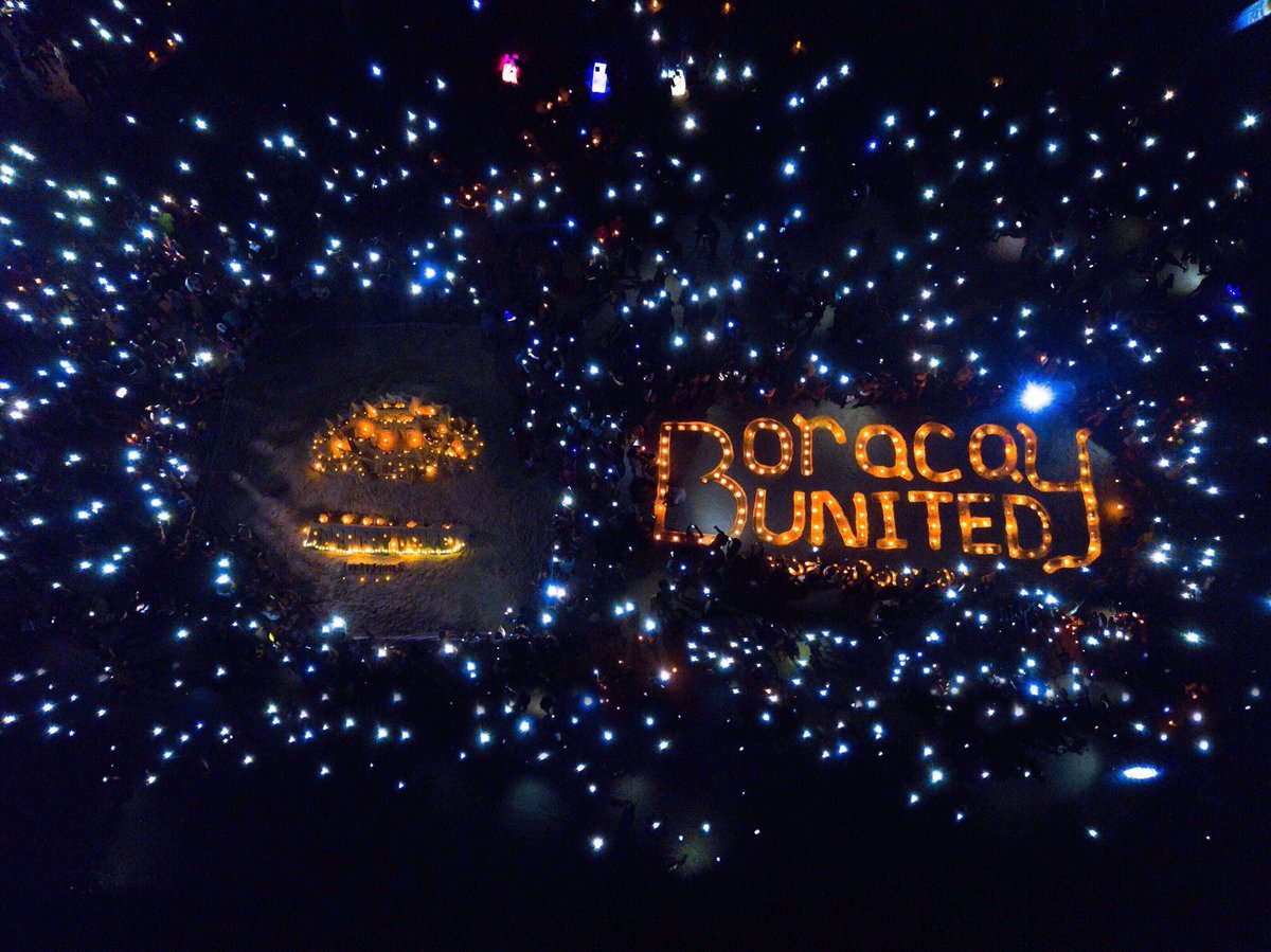 PhilippineStar's tweet photo. Locals and tourists in Boracay participated in an island-wide lights-off campaign to send a message: save Boracay but don’t shut it down. The efforts will continue tomorrow morning with a community unification event along White Beach | via @chonxtibajia (Photo by Boracay United) https://t.co/cvjyWMu5VK